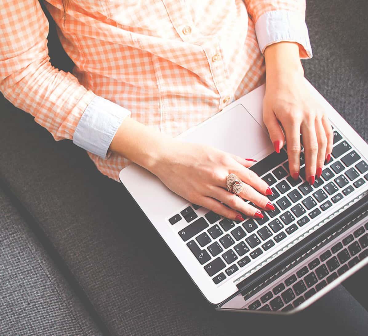 Woman using a laptop.
