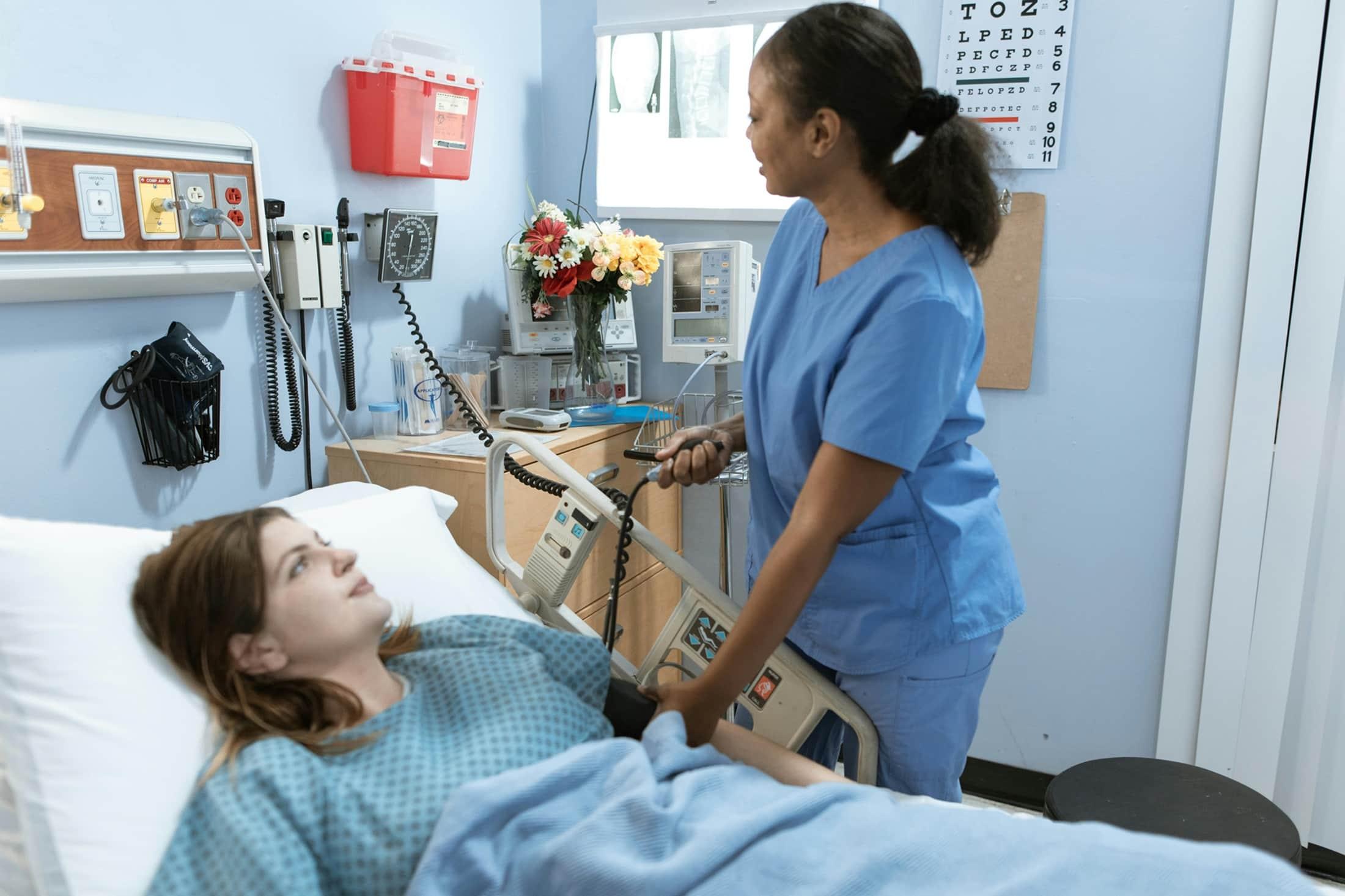 Nurse monitoring patient
