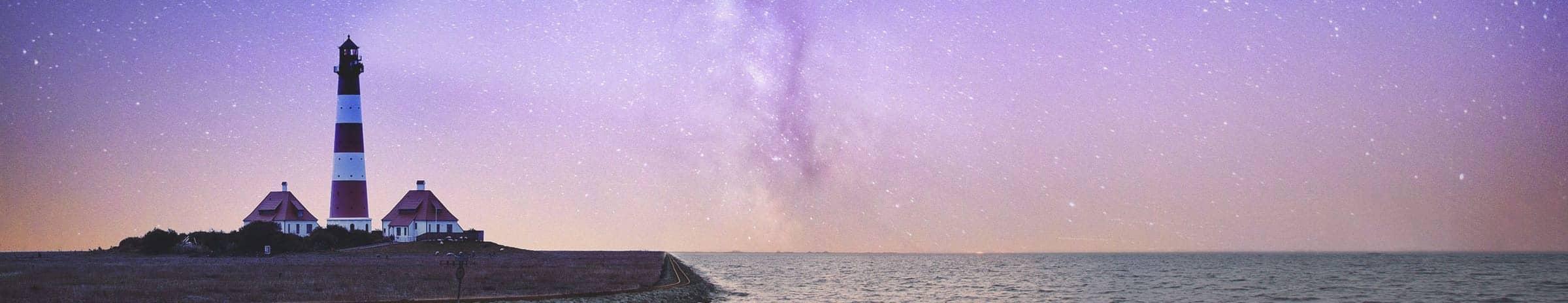 Lighthouse under the clear night sky
